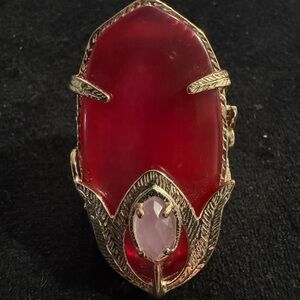 Kendra Scott red stone ring with silver detailed frame and pink center stone